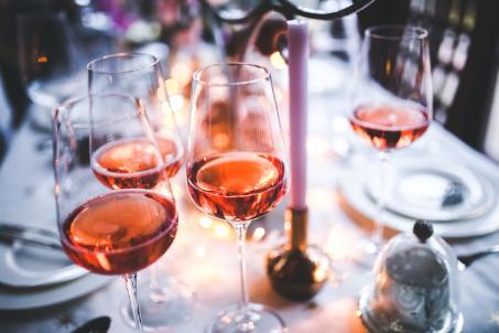 Four wine glasses on a set table